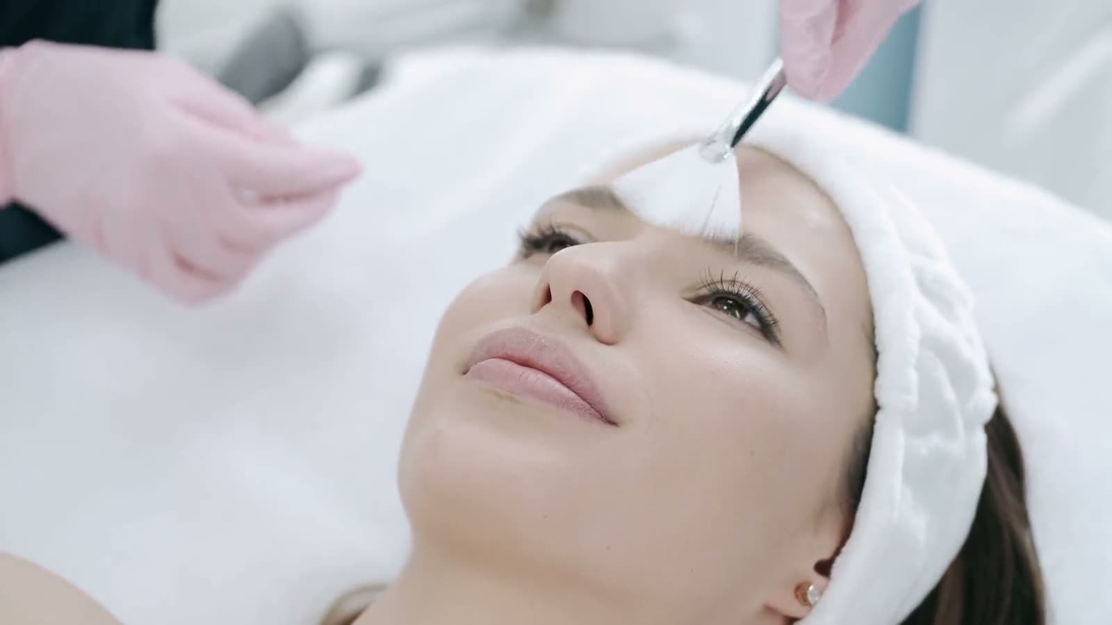 Close-up of a clinical facial in progress